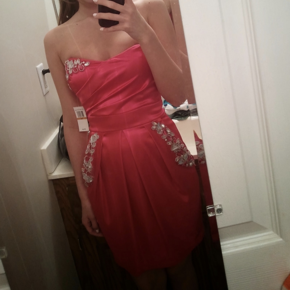Short strapless hot pink formal dress with jewels prom